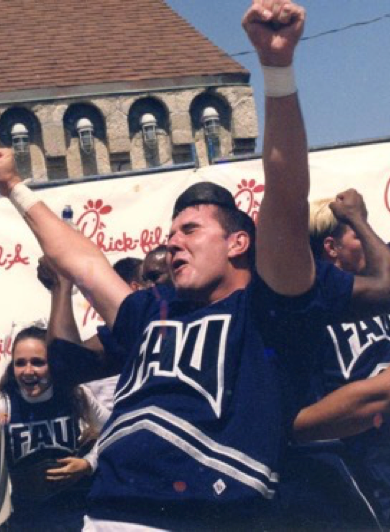 Cheerleader celebrating with team